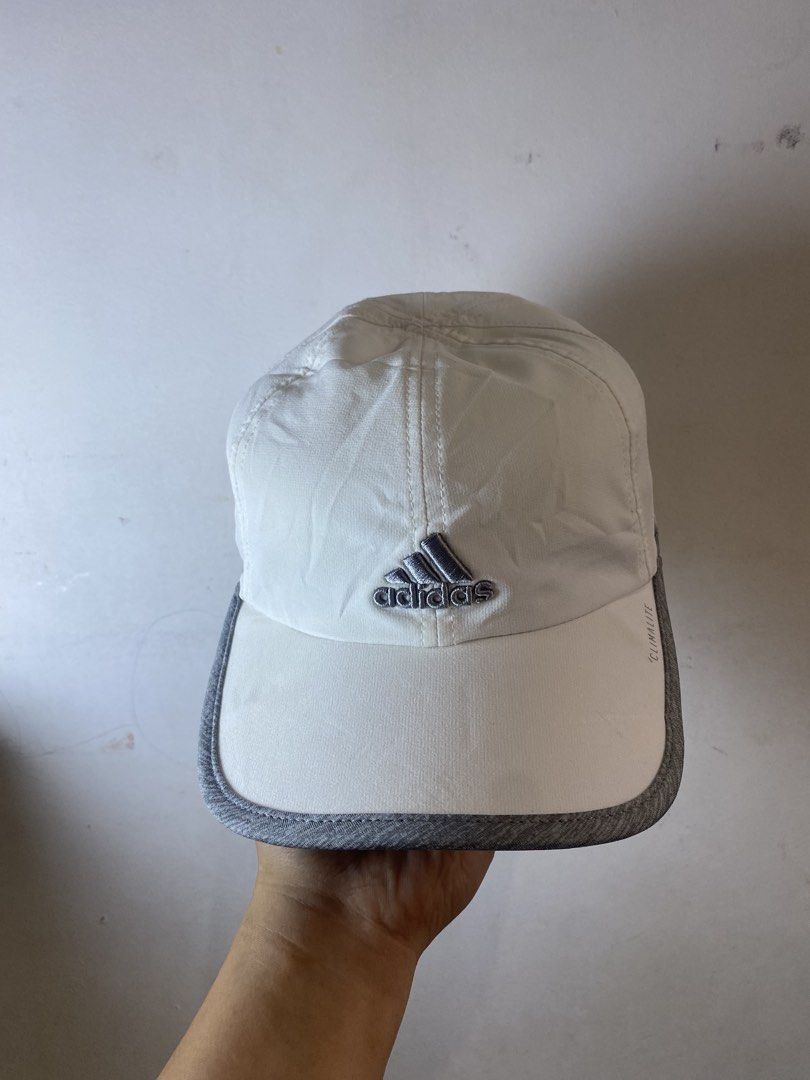 Adidas Climalite White Grey Cap (Category: Caps & Hats) located in Manila. Submitted by kennyfranc39614 (Listing ID 1467516900, Image 1). Description: - Authentic Adidas Cap in white and grey - Climalite technology keeps you dry by wicking away sweat - Curved brim accented with stylish grey trim - Embroidered silver Adidas logo on the front and matching logo patch on the adjustable back strap - Breathable fabric panels on the sides for extra vent