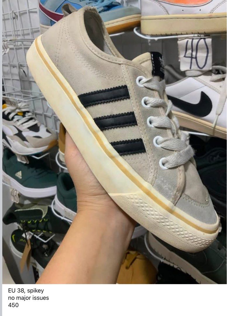 Adidas Nizza sneakers EU 38 (Category: Sneakers) located in Caloocan City. Submitted by Twinsters_2nd (Listing ID 1467448703, Image 1). Description: - Adidas Nizza low-top sneakers. - Off-white canvas upper with grey suede overlays and black three-stripes branding. - White laces and thick rubber midsoles showing mild yellowing from age. - Size EU 38, US5 - Clean overall shape with no major structural damage or heavy wear. - payment first, sh0pee 