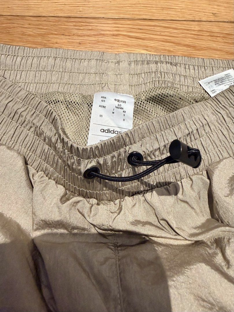 Adidas Nylon Cargo Pants Size S (Category: Activewear) located in Makati City. Submitted by beehive03 (Listing ID 1467458674, Image 1). Description: Excellent condition - Size: US Small (Asia 160/68A, AU/NZ S) - Material: Durable nylon with breathable mesh lining - Waistband: Elastic with adjustable black drawstring and toggle - Pockets: Large utility pockets on both sides - Cuffs: Elastic ankles for a tapered fit - Origin: Made in Vietnam - Cond