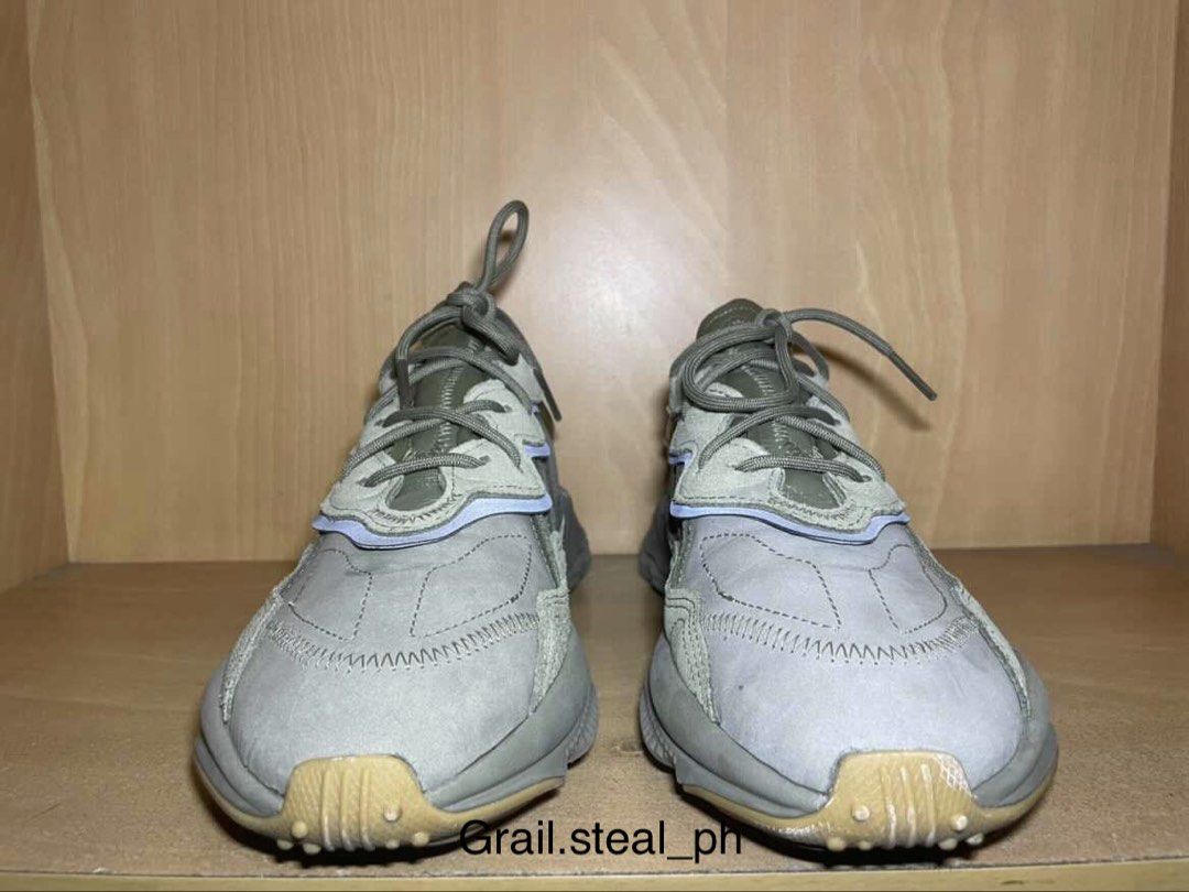 Adidas Ozweego Sneakers with Box (Category: Casual Shoes) located in Quezon City. Submitted by grail.steal_ph (Listing ID 1467388065, Image 2). Description: - Brand: Adidas - Model: Ozweego - Color: trace cargo - Sole: Chunky design with Adiprene cushioning for all-day comfort - Details: Classic three stripes branding, laces tied and ready to wear - Inclusions: Comes with original blue Adidas box - Condition: 7/10.