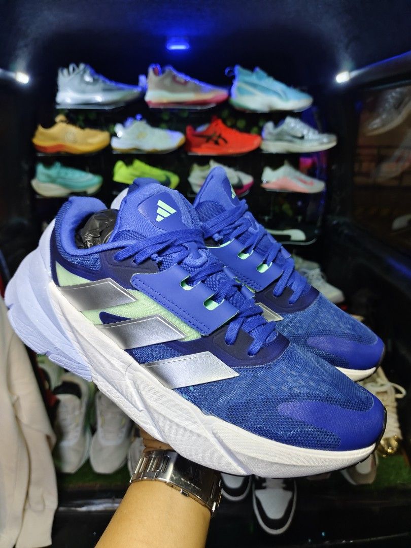 Adidas Running Shoes Blue Size 10 US (Category: Sneakers) located in Bayugan. Submitted by boss_rej (Listing ID 1467525246, Image 1). Description: - Brand: Adidas Running Shoes - Color: Vibrant blue with silver stripes and green accents - Size: US 10, UK 9.5, EUR 44 - Sole: Continental rubber outsole for superior traction and clean white midsole - Condition: Manufactured 10/22, clean, and ready for use - Versatility: Comfortable fit ideal for dai