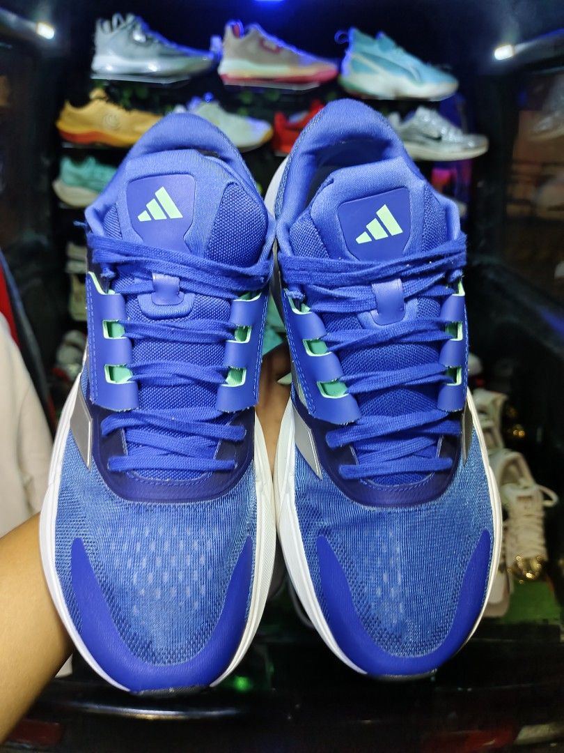 Adidas Running Shoes Blue Size 10 US (Category: Sneakers) located in Bayugan. Submitted by boss_rej (Listing ID 1467525246, Image 3). Description: - Brand: Adidas Running Shoes - Color: Vibrant blue with silver stripes and green accents - Size: US 10, UK 9.5, EUR 44 - Sole: Continental rubber outsole for superior traction and clean white midsole - Condition: Manufactured 10/22, clean, and ready for use - Versatility: Comfortable fit ideal for dai