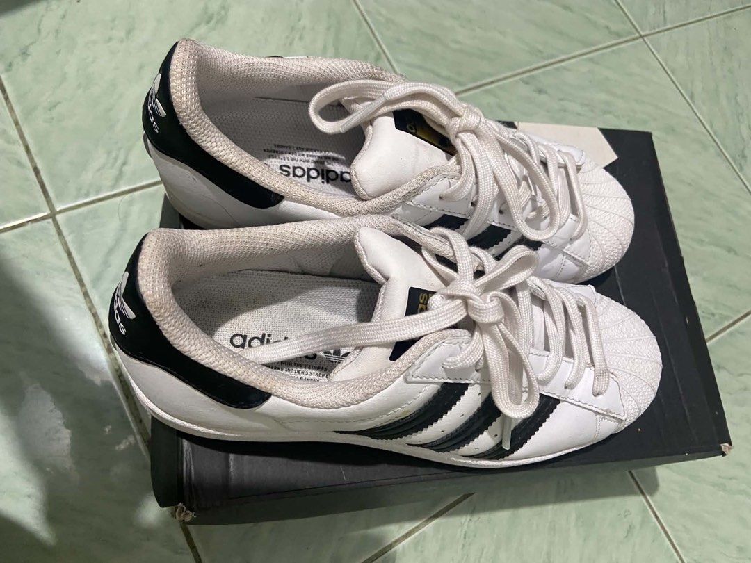 Adidas Superstar White Black Sneakers Size US 7 (Category: Sneakers) located in Manila. Submitted by vanexacast26785 (Listing ID 1467518513, Image 1). Description: - Brand: Adidas Superstar - Colorway: White and Black with iconic shell toe and 3-stripes - Size: US 7 / UK 5.5 / EUR 38.5 / JP 240 - Condition: Clean, with minimal wear on soles and uppers - Inclusion: Original shoe box included.