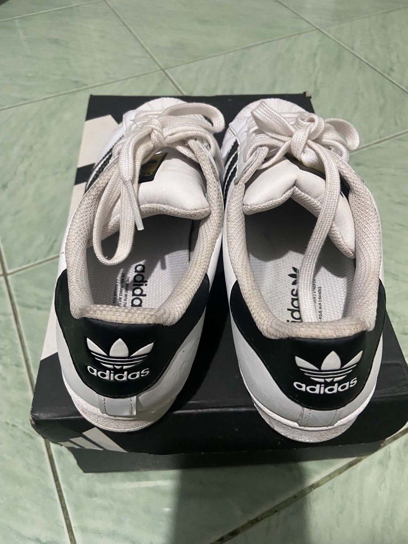 Adidas Superstar White Black Sneakers Size US 7 (Category: Sneakers) located in Manila. Submitted by vanexacast26785 (Listing ID 1467518513, Image 3). Description: - Brand: Adidas Superstar - Colorway: White and Black with iconic shell toe and 3-stripes - Size: US 7 / UK 5.5 / EUR 38.5 / JP 240 - Condition: Clean, with minimal wear on soles and uppers - Inclusion: Original shoe box included.