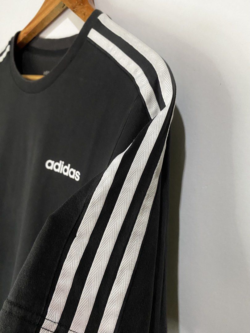 ADIDAS TSHIRT (Category: Tshirts & Polo Shirts ) located in Jaen. Submitted by oshimamark58418 (Listing ID 1467532654, Image 3). Description: - Brand: Adidas Neo - Color: Black with white 3-stripe shoulder design and chest logo - Size: Large (Approx. 21" width x 28" length) - Material: 100% Cotton for maximum comfort and breathability - Condition: Good, well-maintained - Style: Casual / Athletic streetwear.