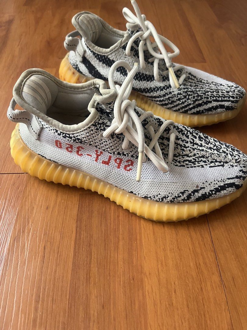 Adidas Yeezy Boost 350 V2 "Zebra" (Style Code: CP9654) (Category: Sneakers) located in Lipa City. Submitted by alexcollectionco (Listing ID 1467480343, Image 1). Description: Iconic Adidas Yeezy Boost 350 V2 in the classic “Zebra” colorway. Features a black and white Primeknit upper with lateral red “SPLY-350” text, translucent Boost-cushioned midsole, and signature pull tab. Specifications & Details: • Brand: Adidas x Yeezy • Model: Yeezy Boost 