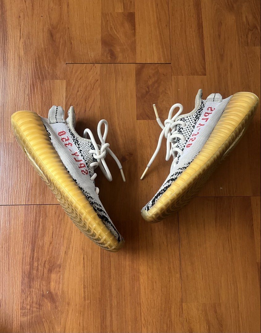 Adidas Yeezy Boost 350 V2 "Zebra" (Style Code: CP9654) (Category: Sneakers) located in Lipa City. Submitted by alexcollectionco (Listing ID 1467480343, Image 3). Description: Iconic Adidas Yeezy Boost 350 V2 in the classic “Zebra” colorway. Features a black and white Primeknit upper with lateral red “SPLY-350” text, translucent Boost-cushioned midsole, and signature pull tab. Specifications & Details: • Brand: Adidas x Yeezy • Model: Yeezy Boost 