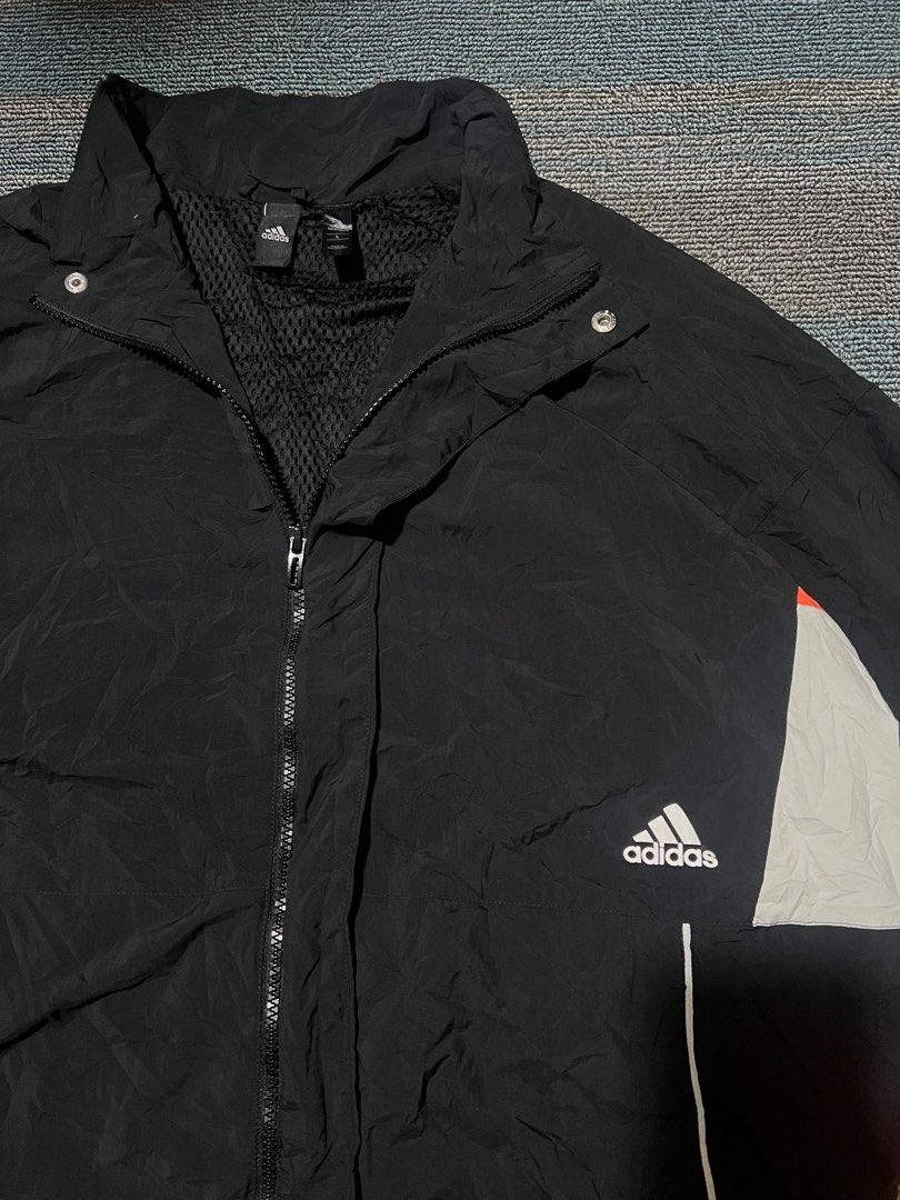 Adidas Zipper Woven Jacket (Category: Coats, Jackets and Outerwear) located in Cebu City. Submitted by mark24anth29233 (Listing ID 1467545725, Image 3). Description: Authentic Size: Large on tag Dimes: See details Excellent t condition Issue: small pinhole not visible .