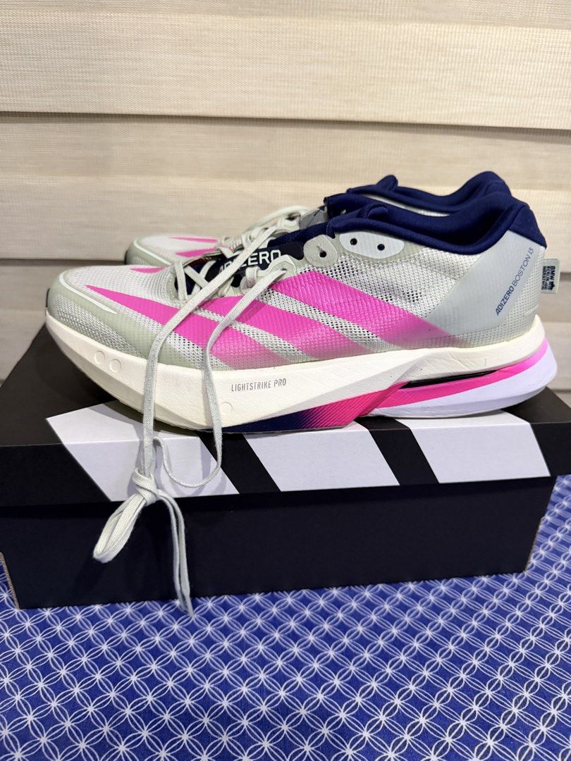 Adizero Boston 13 Berlin Marathon edition (Category: Sneakers) located in Mandaluyong City. Submitted by iynniynn (Listing ID 1467585773, Image 1). Description: php. 5999 US 8.5 men US 10 women Used 6-7x only indoor No foul odor No sole sep No heal drag Adidas Adizero Boston 13 BMW Berlin Marathon Edition in pink (officially styled as Linen Green / Shock Pink / Dark Blue) is a neutral running shoe built for high-speed training and marathon distan