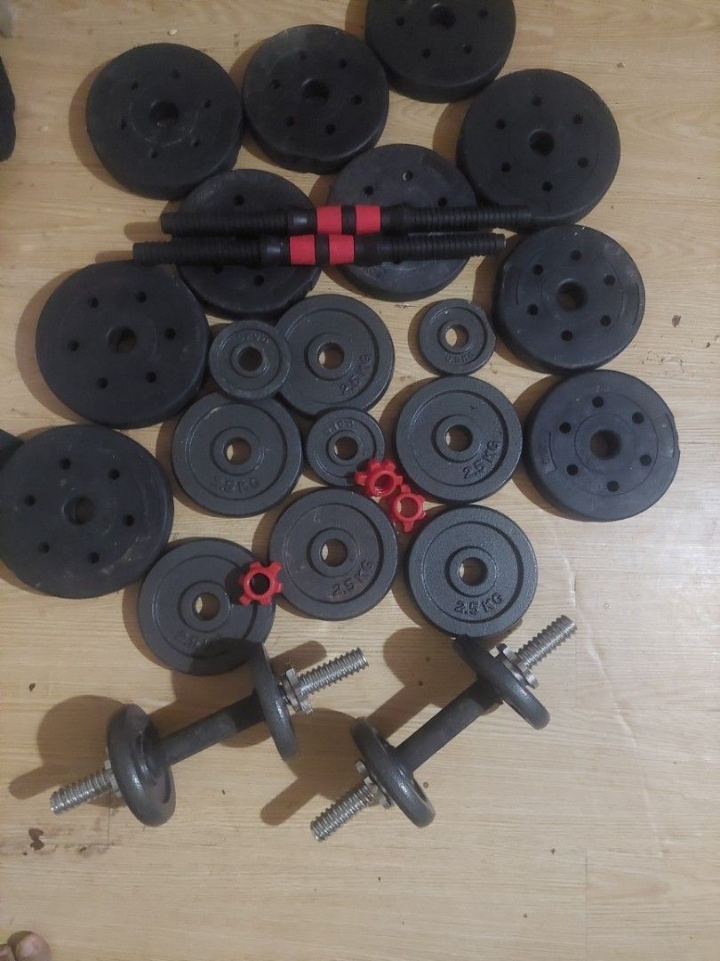 Adjustable Dumbbell Set with Weight Plates (Category: Weights & Dumbbells) located in Taguig. Submitted by iphones.774 (Listing ID 1467386578, Image 1). Description: - Adjustable dumbbell set ideal for home workouts - Includes 2 dumbbell bars, spinlock collars, and multiple weight plates - Quick and easy weight adjustment to suit any exercise routine - Space-saving design, perfect for home gyms - Great for building strength and leveling up your f