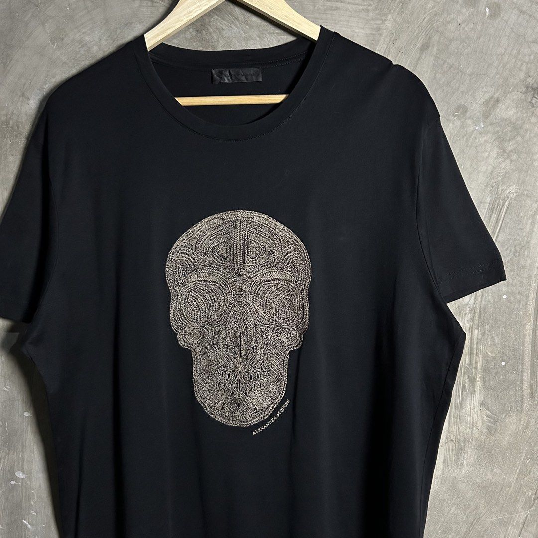 Alexander Mcqueen - Textured Skull Black Tee (Category: Luxury Apparel) located in Tayabas. Submitted by streetdepartment (Listing ID 1467546334, Image 2). Description: Alexander Mcqueen - Textured Skull Black Tee Excellent condition Flaw/s: minor loose stitch on neckline and needswash Size: XXL fits XL Measurements (inches): Width: 23” Length: 30” Dm to purchase! Note: Manage your expectations as you are dealing with secondhand items. Color may 