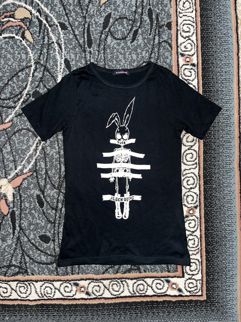 Algonquins Graphic Tee Rabbit Skeleton (Category: Tshirts & Polo Shirts ) located in Manila. Submitted by kashjulliane (Listing ID 1467366615, Image 1). Description: - Brand: Algonquins (Classic Japanese Punk Goth Street Fashion) - Color: Black - Size: Large - Material: Soft, comfortable cotton - Design: Bold front graphic of a bunny skull tied up with 'FUCK!!' and 'ALGONQUINS' banner tapes - Details: Classic crew neck, short sleeves with unique 
