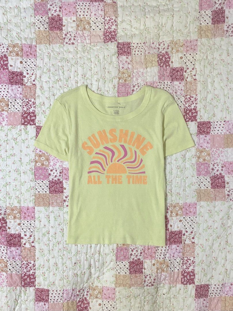 american eagle baby tee printed butter yellow (Category: Shirts) located in San Jose. Submitted by vintagexxo (Listing ID 1467491879, Image 1). Description: size: s-m .