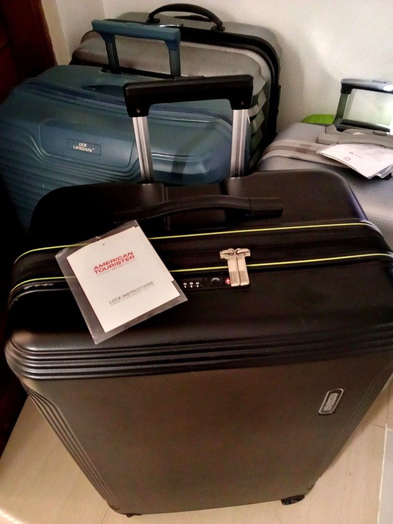 American Tourister Black Spinner Suitcase (Category: Luggage) located in Quezon City. Submitted by santos2016 (Listing ID 1467555152, Image 3). Description: - Brand: American Tourister - Color: Sleek black - Type: Durable hard shell suitcase - Mobility: Smooth rolling wheels and telescopic handle - Security: Built-in lock for safety - Interior: Spacious packing capacity for hassle-free travel - Bonus: Original instructions booklet attached near t