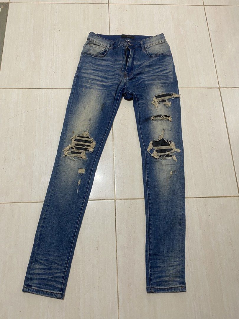 AMIRI Distressed Slim Jeans Size 30 (Category: Jeans) located in Alburquerque. Submitted by zanegavynn43872 (Listing ID 1467363978, Image 1). Description: - Brand: AMIRI - Style: Distressed denim jeans with blue wash - Size: 30 - Details: Distressed knees with ribbed underlays and signature Riri hardware on the fly - Material: 98% cotton, 2% elastane (Made in USA with Italian materials) - Condition: Excellent, with clean interior tags and waist b