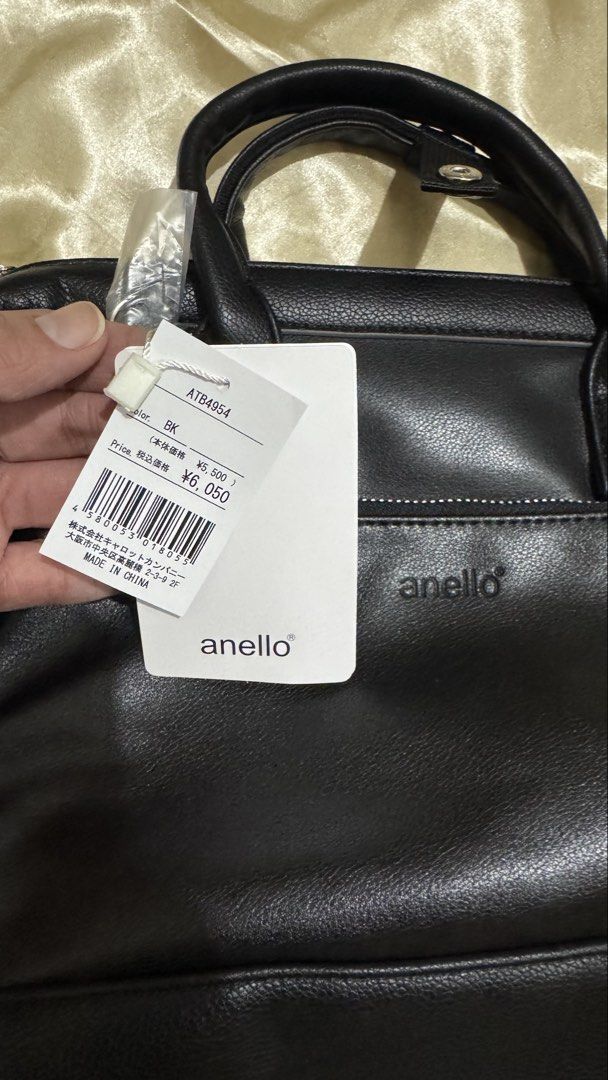 Anello RETRO Black Leather 2WAY bag A5 (Category: Shoulder Bags) located in Bacoor. Submitted by apotatochip (Listing ID 1467522331, Image 2). Description: - Brand new Anello tote bag (Model ATB4954) with original store tags - Made from soft black faux leather - Dual carry handles and a convenient adjustable shoulder strap - Front zippered pocket accented with metal branding - Spacious main compartment with an extra zippered side pocket inside.