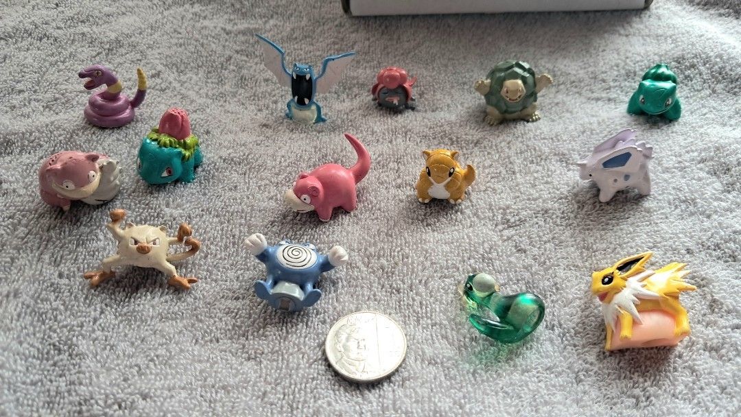 Any 2 for 280 Vintage Pokemon Mini Figures (Category: Figurines & Statues) located in Cavite. Submitted by naning049 (Listing ID 1467498222, Image 1). Description: - Set of 13 classic Pokémon mini figurines - Includes Golbat, Ivysaur, Slowpoke, Mankey, Poliwrath, Jolteon, and others - Features mixed solid plastic and translucent styles - Coin shown in photos for size reference - Ideal starter set for collectors or cute desktop displays.