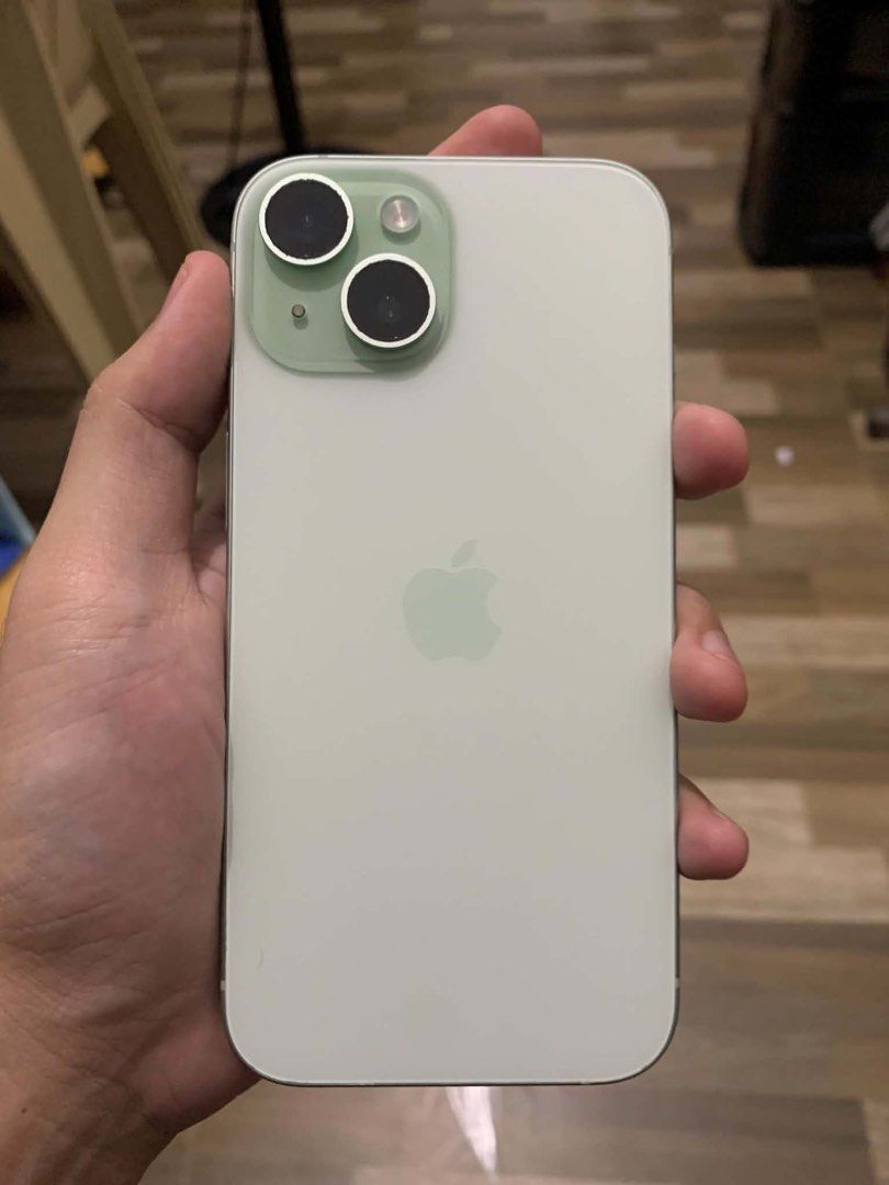 Apple iPhone Green (Category: iPhone 15 Series) located in Imus. Submitted by kcarlbengala20-96124 (Listing ID 1467440925, Image 1). Description: - Color: Green with dual rear cameras - Battery Health: 91% (448 cycle counts) - Battery History: Genuine Apple battery replacement - Condition: Clean back glass and side frame.