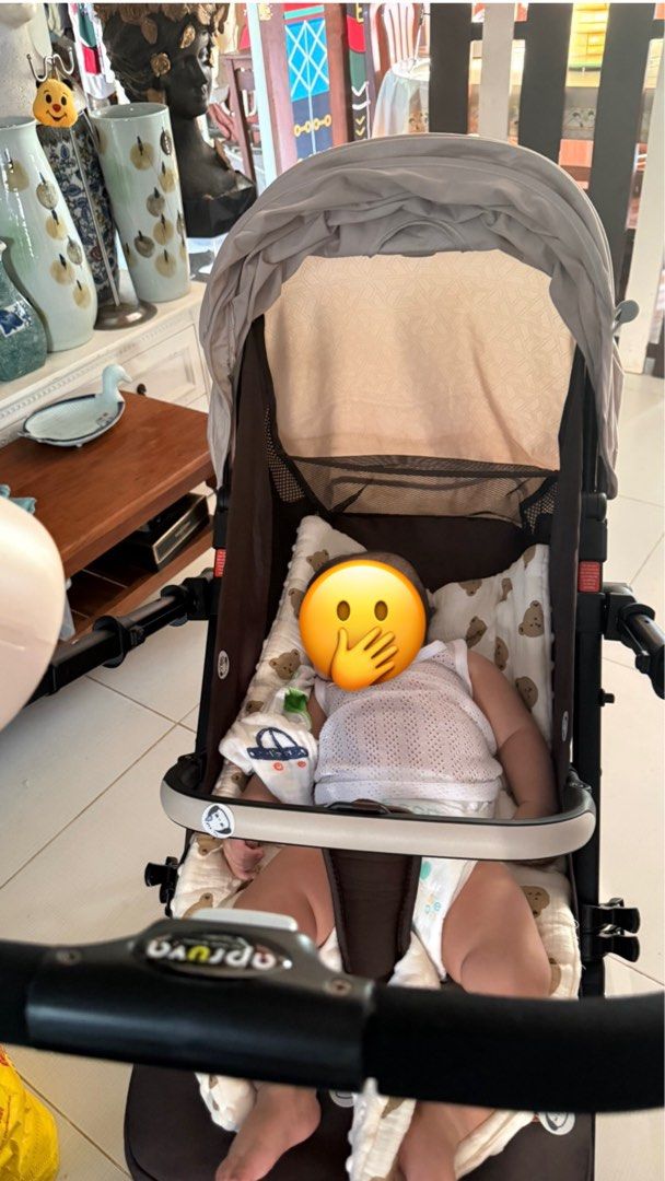 Apruva Axel Deluxxe Reversible Stroller (Category: Strollers) located in Baybay. Submitted by julahrome27 (Listing ID 1467594822, Image 3). Description: - Brand/Model: Apruva Axel Deluxxe Reversible Stroller - Color: Beige and dark brown - Condition: Clean and gently used - Reversible handle: Baby can face you or the world - Compact folding design with a convenient top pull handle for easy rolling - Large storage basket underneath - Full coverage