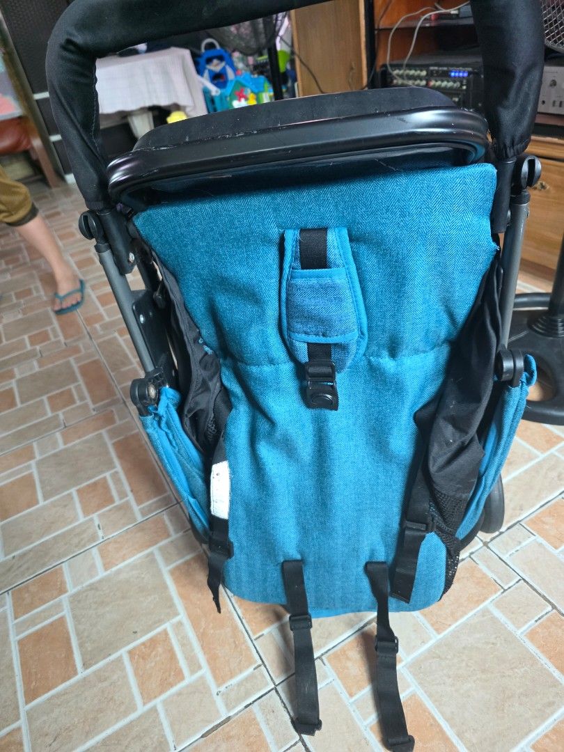 Apruva Blue and black foldable baby stroller with canopy (Category: Strollers) located in Taguig. Submitted by dilyndelro36287 (Listing ID 1467475433, Image 3). Description: - Stylish blue fabric seat with matching canopy - Sturdy black frame with secure safety straps - Convenient storage basket underneath for bags and baby essentials - Compact fold design for easy storage and transport - Comfortable padded push handle for daily walks and trips o