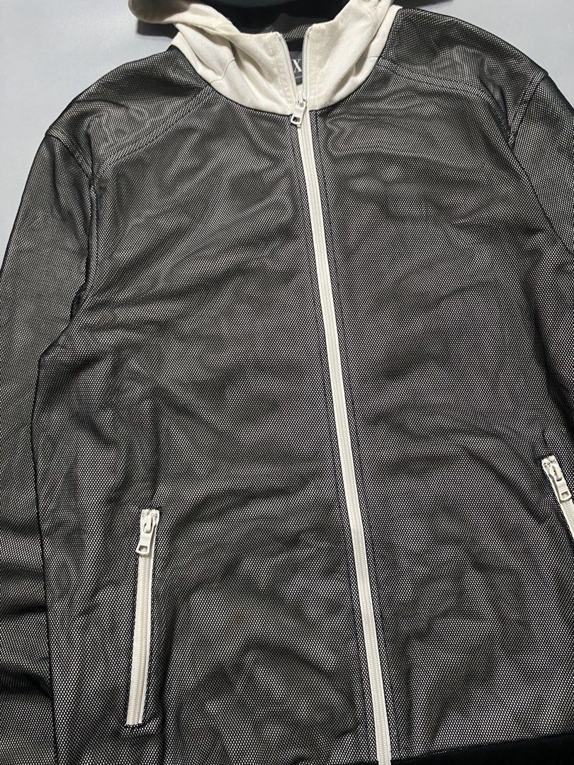Armani Exchange Mesh Zip-Up Hoodie (Category: Coats, Jackets and Outerwear) located in Manila. Submitted by delunakenn94368 (Listing ID 1467509631, Image 2). Description: - Brand: Armani Exchange - Size: Large (L) - Color: Black mesh body with contrasting white hood and zipper - Pockets: Two secure front zippered pockets - Details: Ribbed black cuffs and hem, AX logo patch on the inside collar tag - Origin: Made in Vietnam - Condition: Excellent,