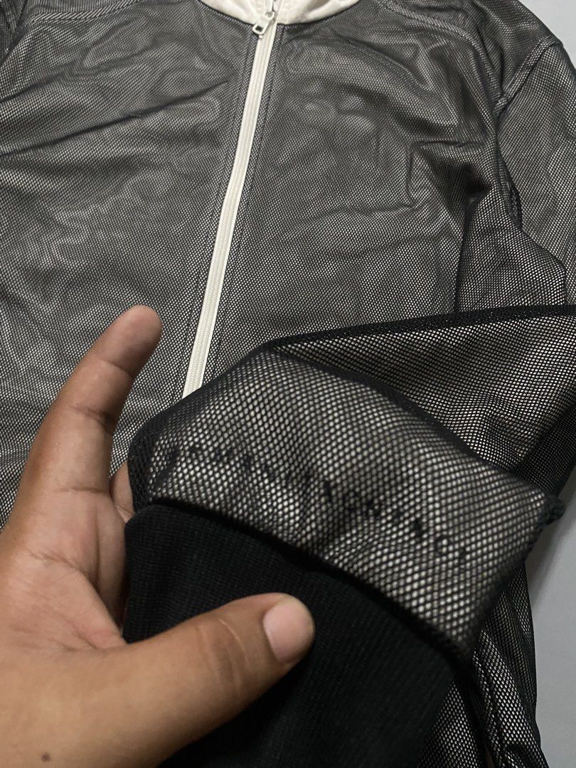 Armani Exchange Mesh Zip-Up Hoodie (Category: Coats, Jackets and Outerwear) located in Manila. Submitted by delunakenn94368 (Listing ID 1467509631, Image 3). Description: - Brand: Armani Exchange - Size: Large (L) - Color: Black mesh body with contrasting white hood and zipper - Pockets: Two secure front zippered pockets - Details: Ribbed black cuffs and hem, AX logo patch on the inside collar tag - Origin: Made in Vietnam - Condition: Excellent,