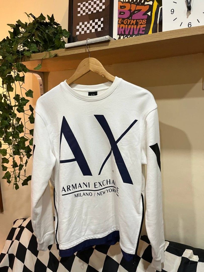 Armani Exchange white crewneck sweatshirt (Category: Luxury Apparel) located in Quezon City. Submitted by michypeachyy1 (Listing ID 1467547225, Image 1). Description: 2500 plus ship medium size removable stain.