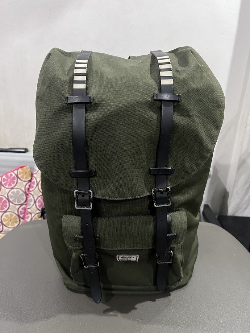 Army Green Herschel Supply Co. Canvas Backpack (Category: Backpacks) located in Quezon City. Submitted by thegroovearchive (Listing ID 1467495504, Image 1). Description: Size - Height: 20” - Width: 11” - Depth: 6.5” - Issue: see pics (needs cleaning) - Brand: Herschel Supply Co. - Color: Green - Material: Durable canvas body (clean overall) - Features: Dual front straps with metal buckles, front pocket with classic woven label, secure top-flap cl