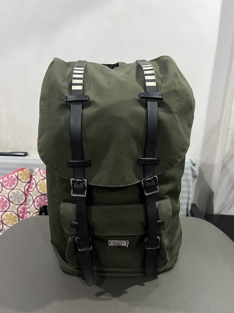 Army Green Herschel Supply Co. Canvas Backpack (Category: Backpacks) located in Quezon City. Submitted by thegroovearchive (Listing ID 1467495504, Image 2). Description: Size - Height: 20” - Width: 11” - Depth: 6.5” - Issue: see pics (needs cleaning) - Brand: Herschel Supply Co. - Color: Green - Material: Durable canvas body (clean overall) - Features: Dual front straps with metal buckles, front pocket with classic woven label, secure top-flap cl