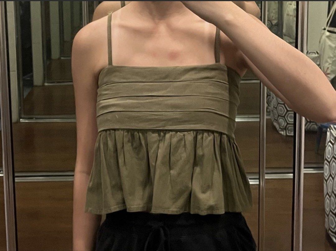 Army Green Tank Top (Category: Sleeveless) located in Pasig City. Submitted by mxvxt (Listing ID 1467446489, Image 3). Description: 〰 in good condition, has adjustable straps 〰 fits XS-S frame 〰 cute & dainty summer european top! 〰 rfs: decluttering .