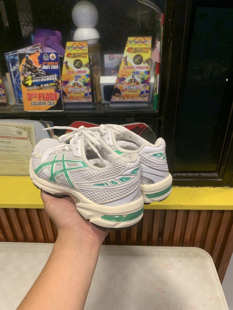 Asics White and Green Sneakers (Category: Sneakers) located in Molave. Submitted by mattjalamanadoromal323 (Listing ID 1467521793, Image 3). Description: - Brand/Model: Asics sneakers - Colorway: White mesh base with mint green stripes, cream midsole, and black rubber outsole - Condition: Very clean uppers, soles show barely any tread wear - Versatility: Perfect as everyday running shoes or casual streetwear.