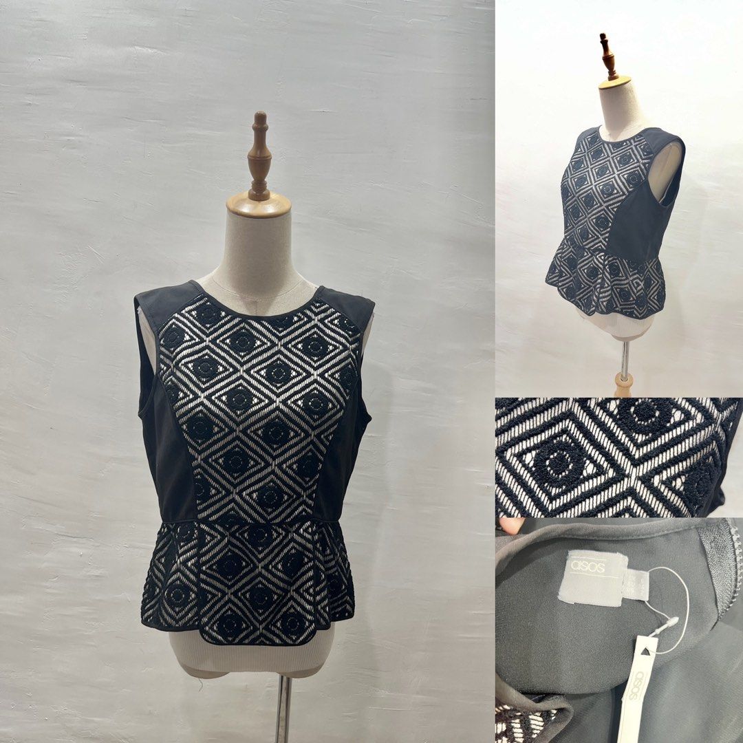 ASOS Black Geometric Lace Peplum Top (Category: Blouses) located in Bacolod City. Submitted by bhabissagal-05763 (Listing ID 1467458537, Image 1). Description: - Brand: ASOS - Condition: Brand new with tags still attached - Design: Black and white geometric lace pattern - Fit: Sleeveless, fitted bodice, and flared peplum waist - Closure: Convenient back zip.