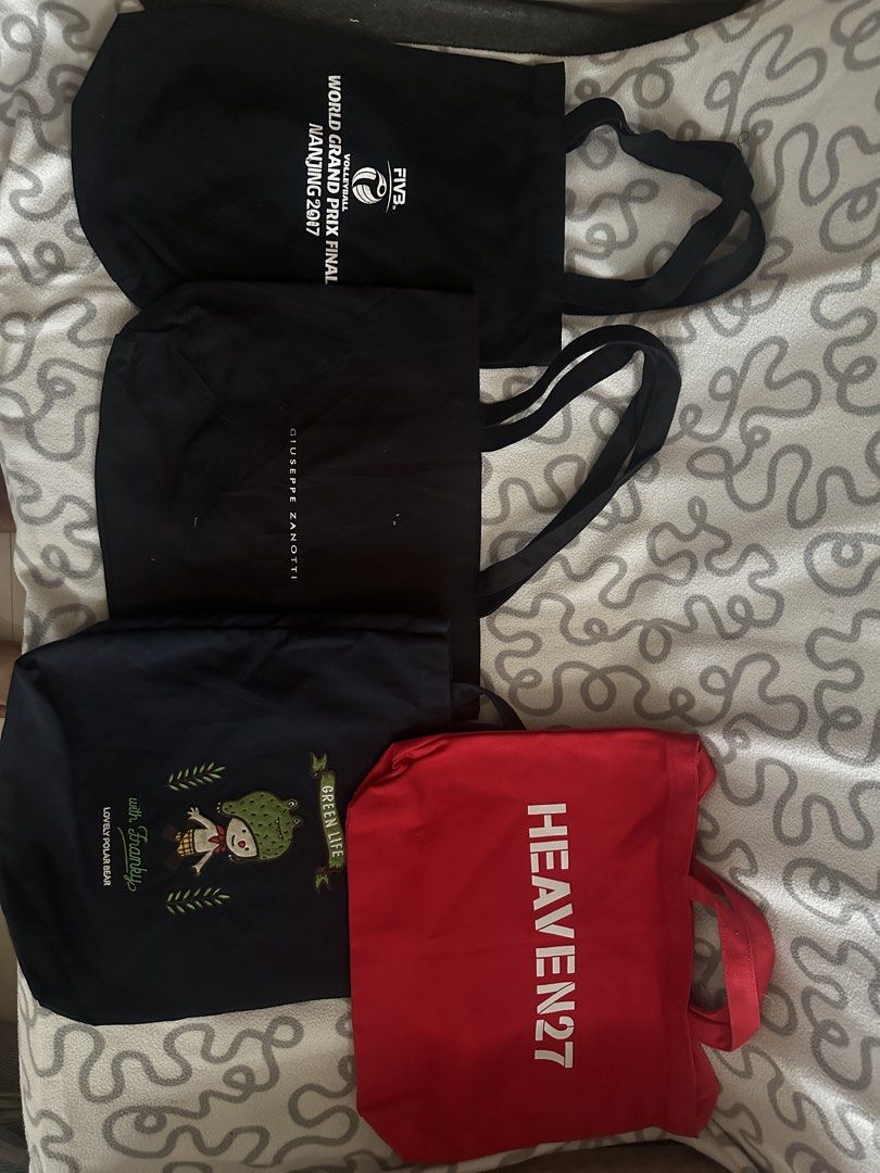 Assorted canvas and transparent tote bags bundle (Category: Tote Bags) located in Quezon City. Submitted by astroboiixx (Listing ID 1467426630, Image 3). Description: - Assorted tote bags in various colors, designs, and materials - Options include printed canvas, plain utility styles, graphic designs, and a blue transparent PVC bag - Features multiple handle and strap styles for comfortable carrying - Ideal for casual daily use, errands, shopping