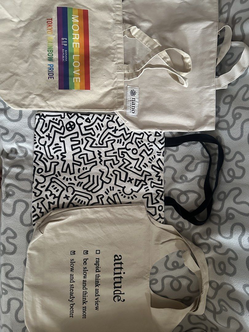 Assorted canvas and transparent tote bags bundle (Category: Tote Bags) located in Quezon City. Submitted by astroboiixx (Listing ID 1467426630, Image 2). Description: - Assorted tote bags in various colors, designs, and materials - Options include printed canvas, plain utility styles, graphic designs, and a blue transparent PVC bag - Features multiple handle and strap styles for comfortable carrying - Ideal for casual daily use, errands, shopping