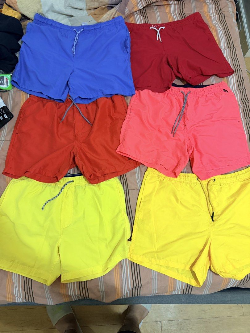 Assorted Men Pants and Swim Shorts Bundle (Category: Shorts) located in Manila. Submitted by aaranaa (Listing ID 1467448715, Image 1). Description: - Wardrobe clear-out bundle - 6x bright swim shorts (yellow, red, blue, pink) - 4x trousers (light wash jeans, dark check pants, grey plaid trousers, solid dark pants) - Condition: Decent shape, ready to wear Prices: Shorts - 100 each Pants - 200-300 each .