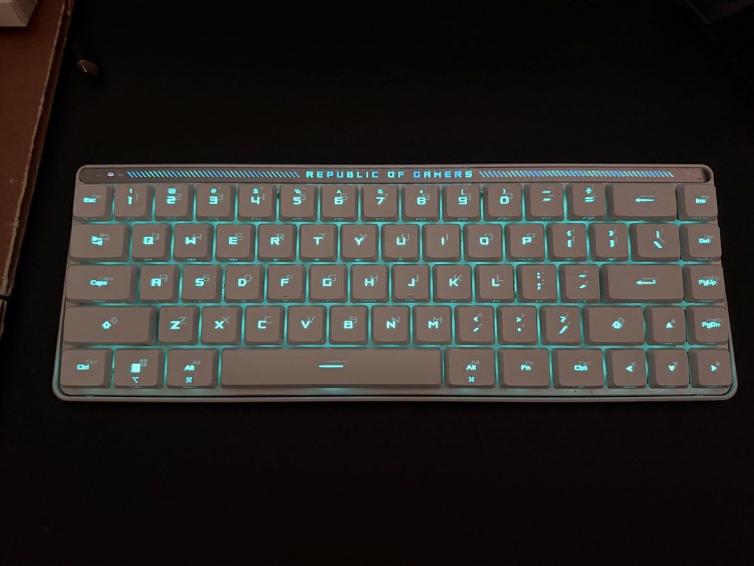 Asus Low Profile Falchion Keyboard (Category: Computer Keyboard) located in Valenzuela. Submitted by glgo86 (Listing ID 1467447355, Image 2). Description: - Brand: Republic of Gamers (ROG) - Color: White with blue backlight illumination - Layout: Compact with dedicated arrow keys and function cluster - Design: Sturdy frame with clean keycaps and signature top accent bar - Connectivity: Wireless - Condition: Fully functional, perfect for gaming se