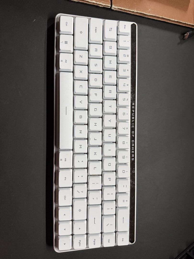 Asus Low Profile Falchion Keyboard (Category: Computer Keyboard) located in Valenzuela. Submitted by glgo86 (Listing ID 1467447355, Image 1). Description: - Brand: Republic of Gamers (ROG) - Color: White with blue backlight illumination - Layout: Compact with dedicated arrow keys and function cluster - Design: Sturdy frame with clean keycaps and signature top accent bar - Connectivity: Wireless - Condition: Fully functional, perfect for gaming se