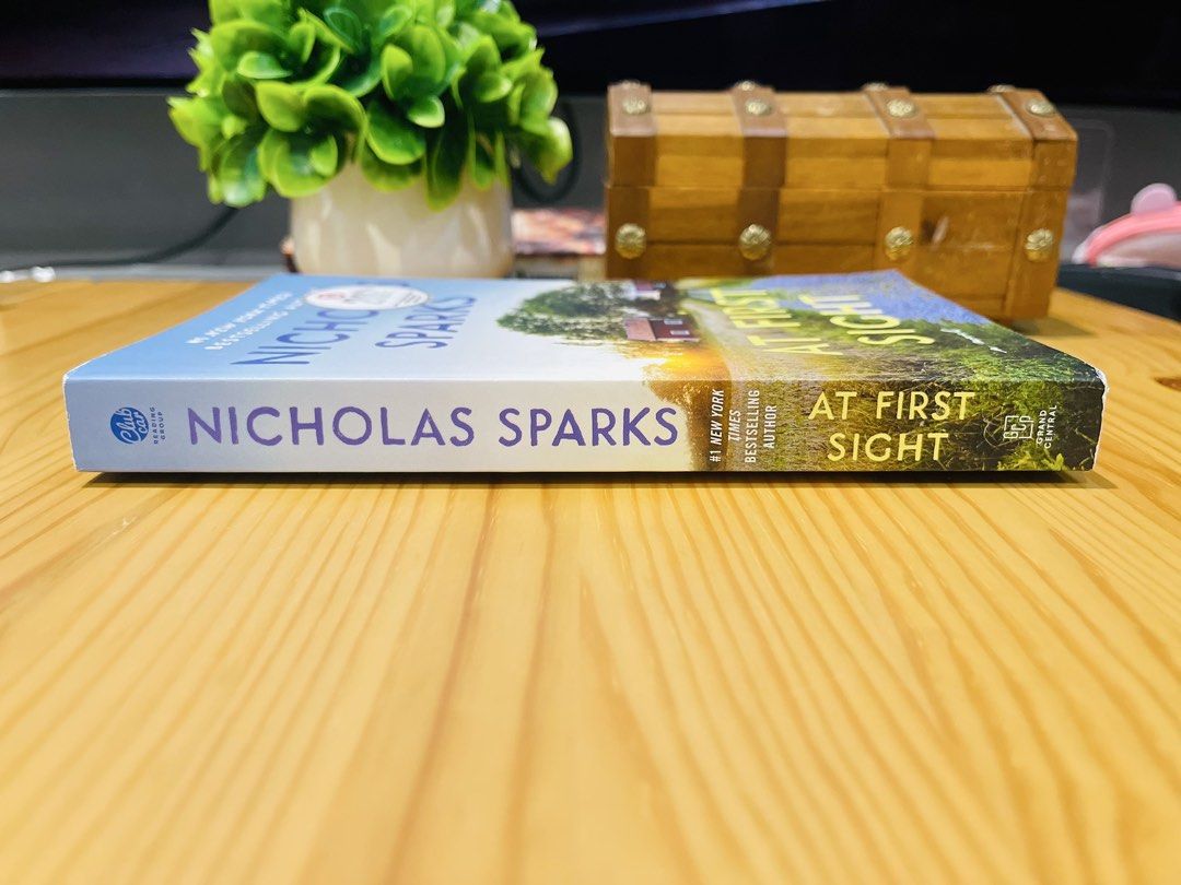 At First Sight by Nicholas Sparks Paperback Novel (Category: Storybooks) located in Makati City. Submitted by pagesandplay (Listing ID 1467552000, Image 2). Description: - Title: At First Sight by Nicholas Sparks - Format: Paperback - Condition: Clean pages, intact, and well-maintained - Genre: Bestselling romance novel - Features: Beautiful rustic country path cover design - Perfect for: Romance fans and book collectors.