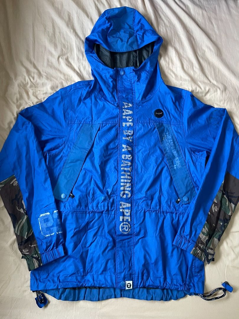 AUTHENTIC AAPE BY A BATHING APE 'BLUE CAMO' WINDBREAKER JACKET (Category: Coats, Jackets and Outerwear) located in Manila. Submitted by ako.si.lemmor (Listing ID 1461849053, Image 1). Description: This item is authentic but thrifted, manage your expectation. Dimes: 21X27.5 (L-XL) Color rate: 8/10 Issue: Print cracks and fades, cleaning, peeled off interior tapes Ship at your own cost or pickup Mandaluyong..