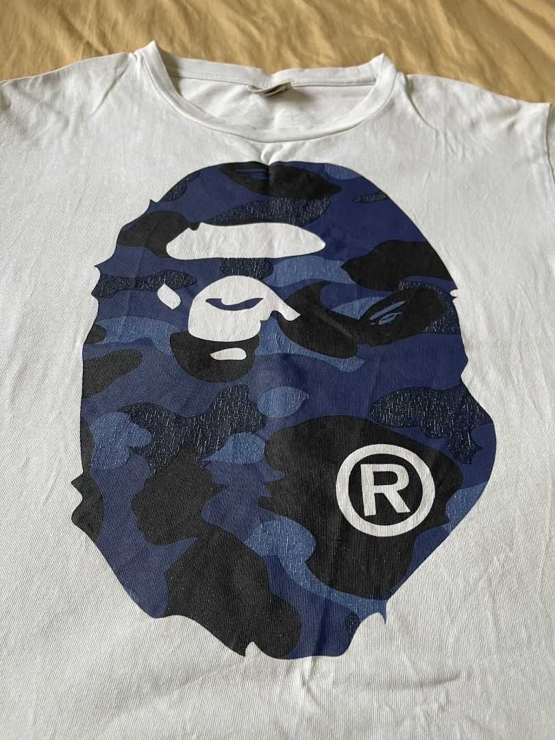 AUTHENTIC BATHING APE 'MIRROR BLUE CAMO HEAD' SHIRT (Category: Tshirts & Polo Shirts ) located in Manila. Submitted by ako.si.lemmor (Listing ID 1467419269, Image 2). Description: This item is authentic but thrifted, manage your expectation. Dimes: 22X26 (L) Color rate: 8/10 Issue: Hairline prints, color fade Shipping at your own cost or pickup Mandaluyong..