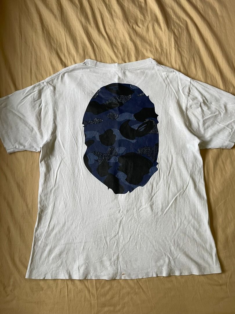 AUTHENTIC BATHING APE 'MIRROR BLUE CAMO HEAD' SHIRT (Category: Tshirts & Polo Shirts ) located in Manila. Submitted by ako.si.lemmor (Listing ID 1467419269, Image 3). Description: This item is authentic but thrifted, manage your expectation. Dimes: 22X26 (L) Color rate: 8/10 Issue: Hairline prints, color fade Shipping at your own cost or pickup Mandaluyong..