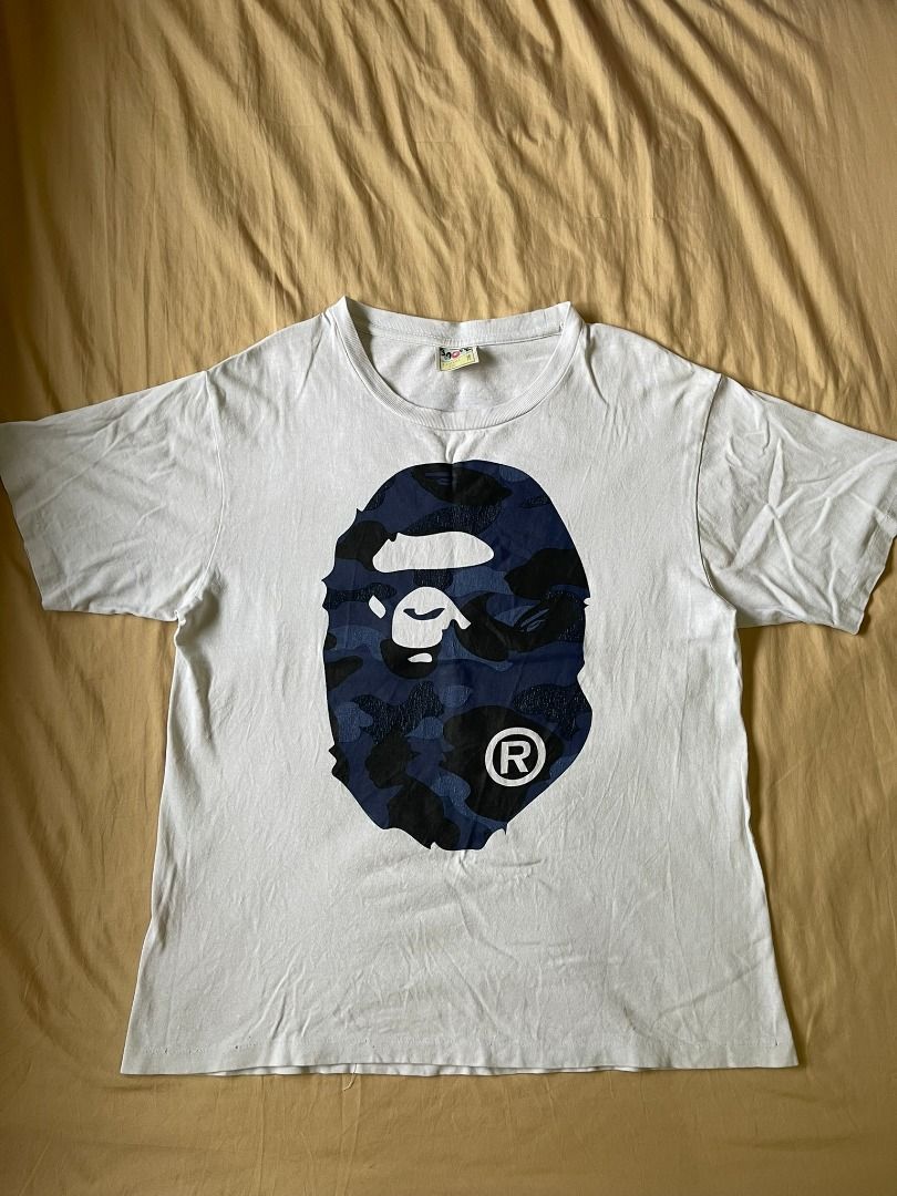 AUTHENTIC BATHING APE 'MIRROR BLUE CAMO HEAD' SHIRT (Category: Tshirts & Polo Shirts ) located in Manila. Submitted by ako.si.lemmor (Listing ID 1467419269, Image 1). Description: This item is authentic but thrifted, manage your expectation. Dimes: 22X26 (L) Color rate: 8/10 Issue: Hairline prints, color fade Shipping at your own cost or pickup Mandaluyong..