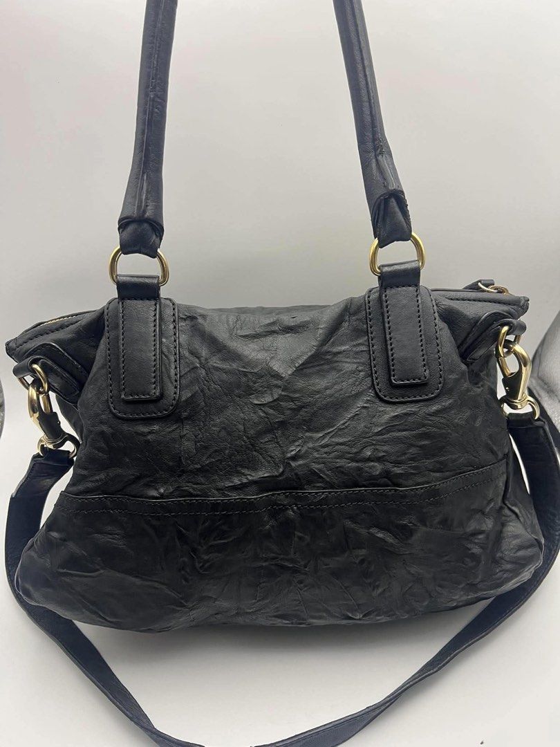 Authentic Givenchy Pandora Large pepe leather. (Category: Cross-body Bags) located in Cagayan de Oro. Submitted by borse_de_amore (Listing ID 1467419205, Image 2). Description: Authentic Givenchy Pandora Large pepe leather. Minor flaw. Filler ng handle nag move na hence nag soften ung isang side ng handle. But nevertheless very sturdy pa. No major flaws other than that. Super nice pa and very spacious. Clean interior, all zippers working smoothly