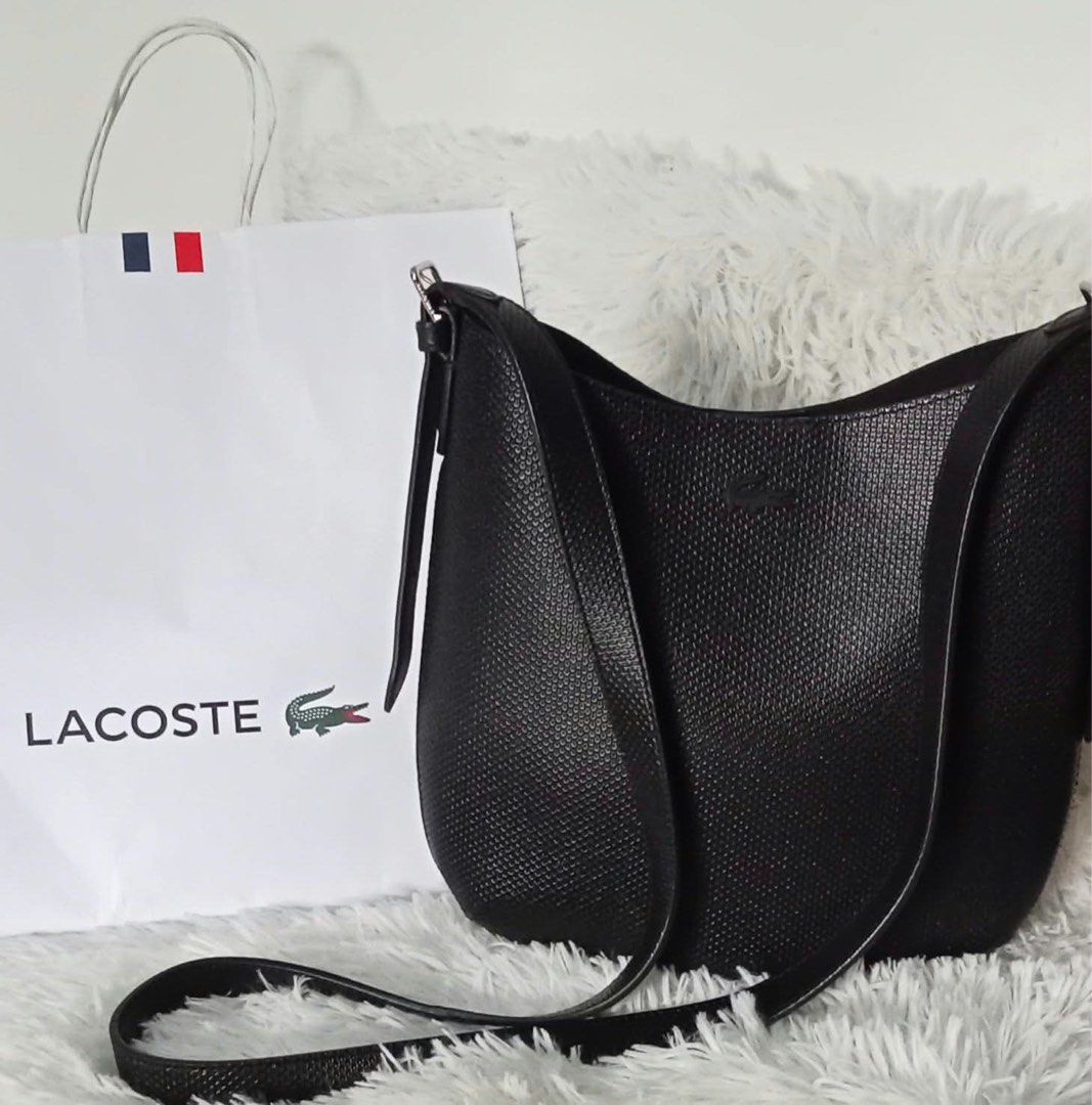 Authentic Lacoste Chantaco Leather Shoulder Bag (Category: Luxury Bags & Wallets) located in Manila. Submitted by prelovedbyjuls17 (Listing ID 1467575254, Image 1). Description: Authentic Lacoste Chantaco Leather Shoulder Bag (Slightly Used / Like New) PRICE: P5,500 DESCRIPTION: Selling my original Lacoste Chantaco Shoulder Bag in classic black. Crafted in signature piqué-textured genuine leather -sleek, structural, and versatile for everyday use