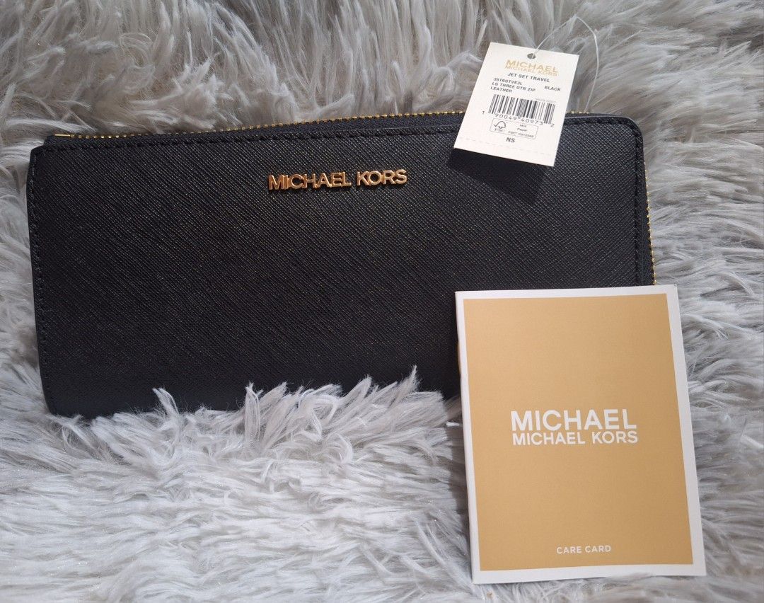 Authentic Michael Kors Long Wallet (Category: Luxury Bags & Wallets) located in Quezon City. Submitted by ilovebigbrands (Listing ID 1467447465, Image 2). Description: Unused jet set one zipped long wallet. Comes with the original plastic packaging, card and price tag. Authenticity guaranteed or money if proven fake..