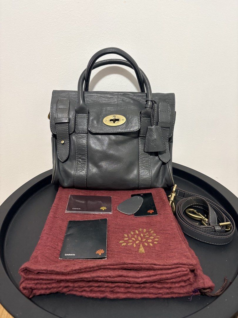 Authentic Mulberry Small Bayswater Satchel Grey Darwin Leather (Category: Luxury Bags & Wallets) located in Manila. Submitted by beian.jco (Listing ID 1467507647, Image 1). Description: Complete Set with Dust Bag, Strap, and Care Cards Super classic and timeless piece! This is the versatile satchel version, so it comes with the detachable strap—can be worn as a top handle, shoulder bag, or crossbody. Condition: • Well-used / Preloved. • The leath