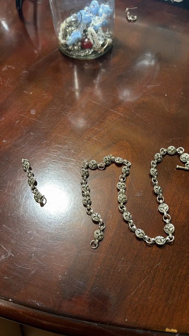 Authentic Silver Chrome Hearts Lace (Category: Necklaces) located in Caloocan City. Submitted by zhnzy (Listing ID 1467433055, Image 1). Description: - Silver-tone chain necklace with small cross links - Secure T-bar clasp closure - Includes a bonus detached smaller section of the same chain - Features authentic vintage tarnishing from age and wear - Unisex design, great for layering.