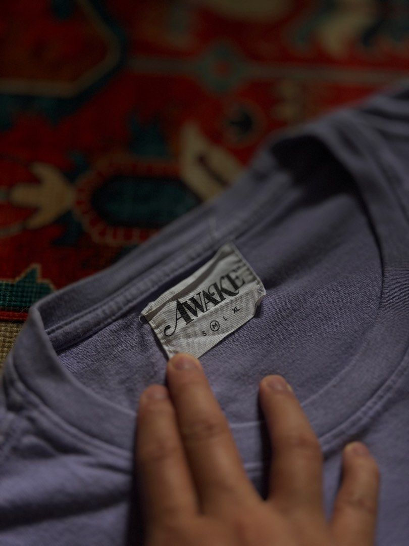 Awake Logo Tee powder purple (Category: Tshirts & Polo Shirts ) located in Manila. Submitted by localstreetwear (Listing ID 1467428699, Image 3). Description: Awake NY Powder purple Tee 700 Used 20wX32L Antipolo City sf shoulder by the buyer.