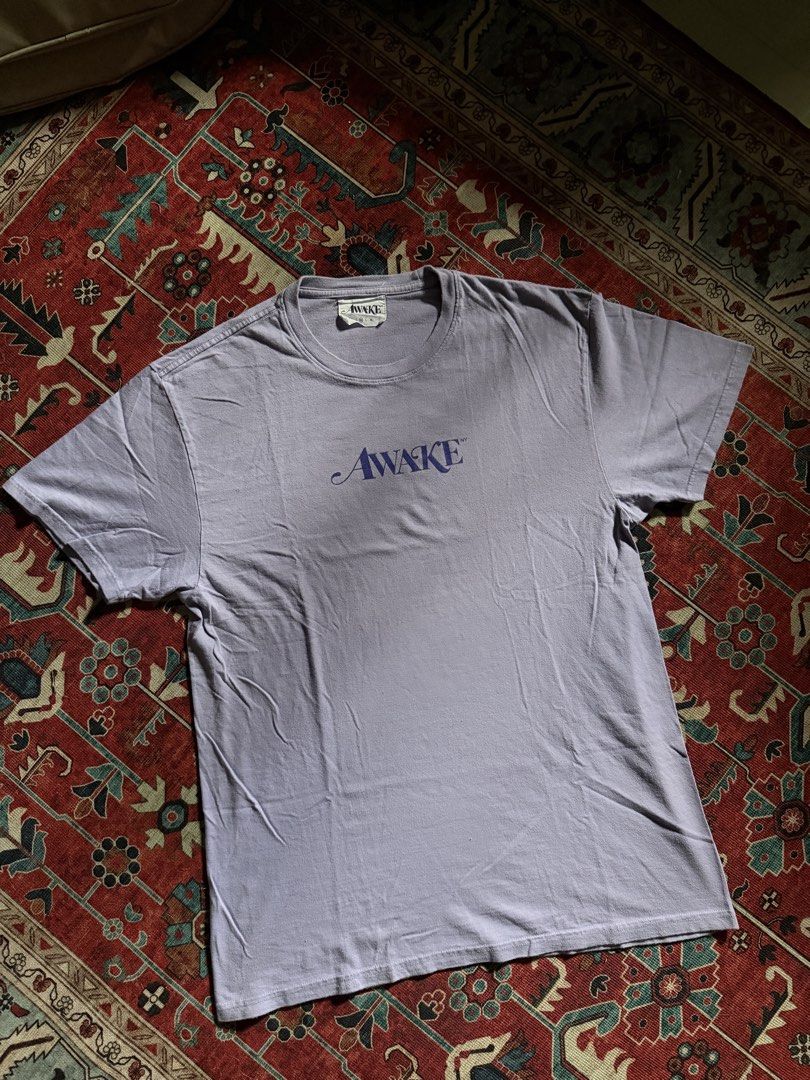 Awake Logo Tee powder purple (Category: Tshirts & Polo Shirts ) located in Manila. Submitted by localstreetwear (Listing ID 1467428699, Image 1). Description: Awake NY Powder purple Tee 700 Used 20wX32L Antipolo City sf shoulder by the buyer.