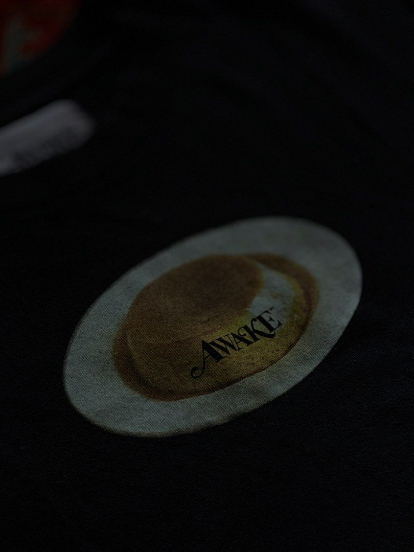 Awake NY “Flan Tee” (Category: Tshirts & Polo Shirts ) located in Manila. Submitted by localstreetwear (Listing ID 1467429584, Image 2). Description: Awake NY flan Tee Small 700 Used 17.5wX26L Antipolo City Sf shoulder by the buyer.